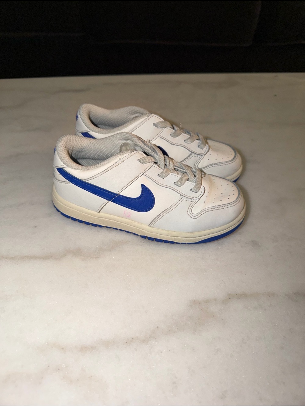 Nike Kids White Sneakers with Blue Swoosh Accent